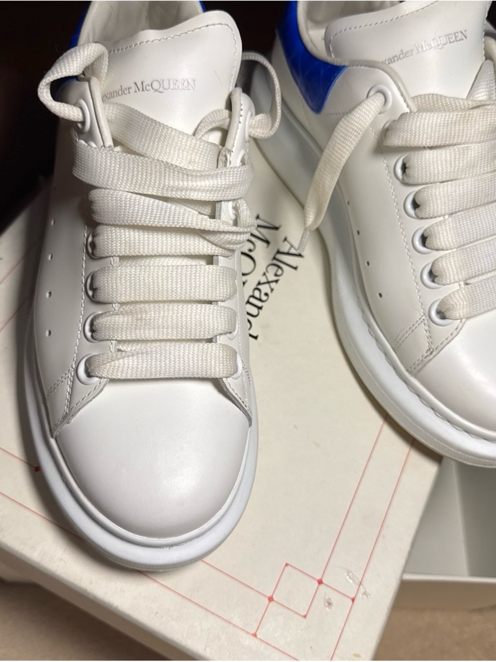 Que White Leather Sneakers with Blue Heel Accent